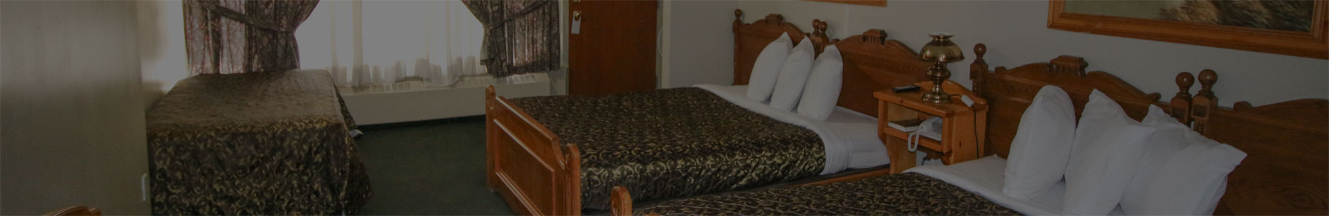Kitchenette Room With Two Queen Beds & Sofa bed | Bighorn Inn & Suites ... - Accommodations With Kitchenette And Sofa Bed